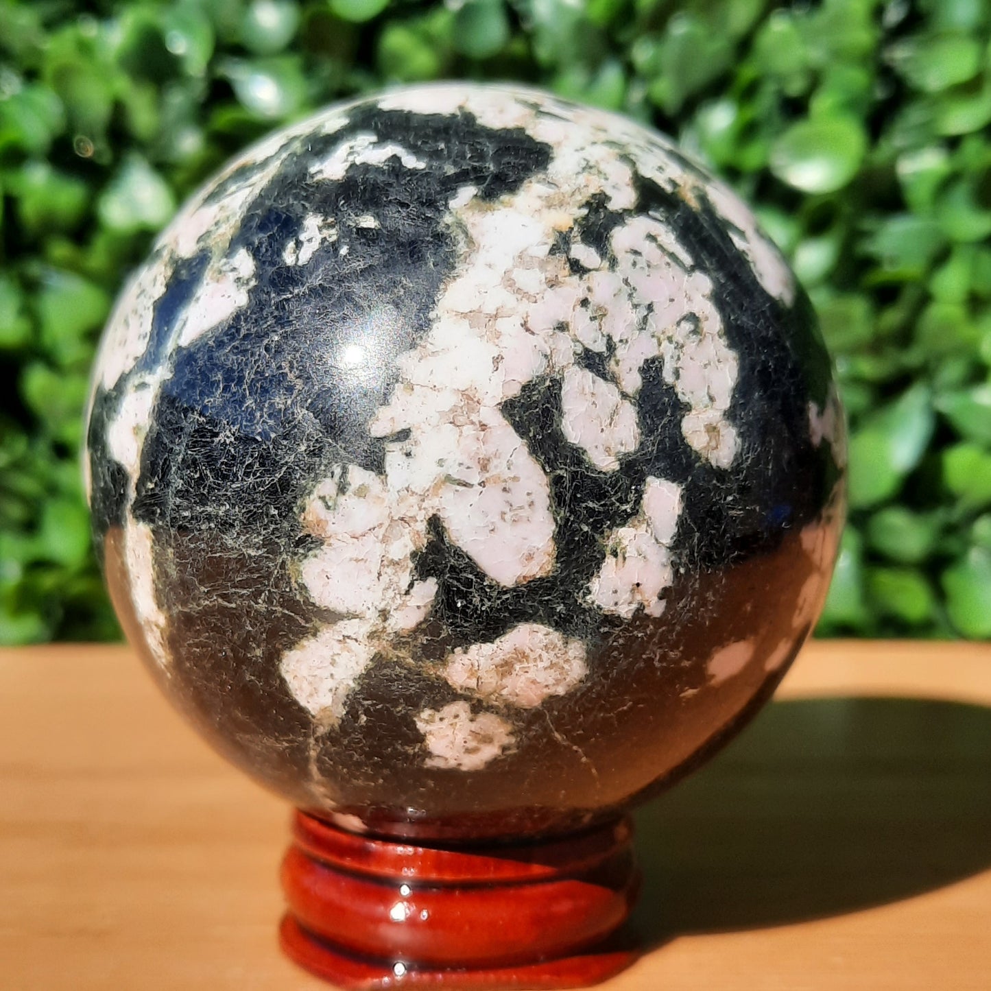 Pink Thulite In Black Jade Sphere